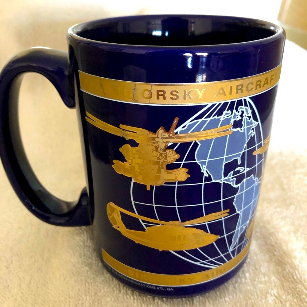 New Specialty Mug, dark blue w/metallic gold Aprox 4 1/2” tall, 5”w/incld handle